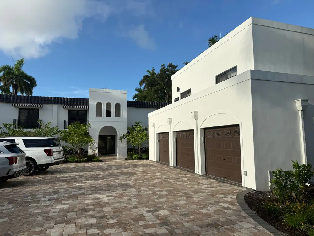 Motor court with three-car garage and arched entry tower